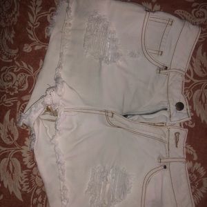 White distressed jean shorts